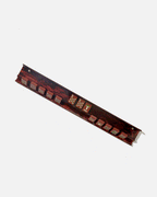 Tobacco Smoke mahjong rack holding a row of Redemption Line tiles