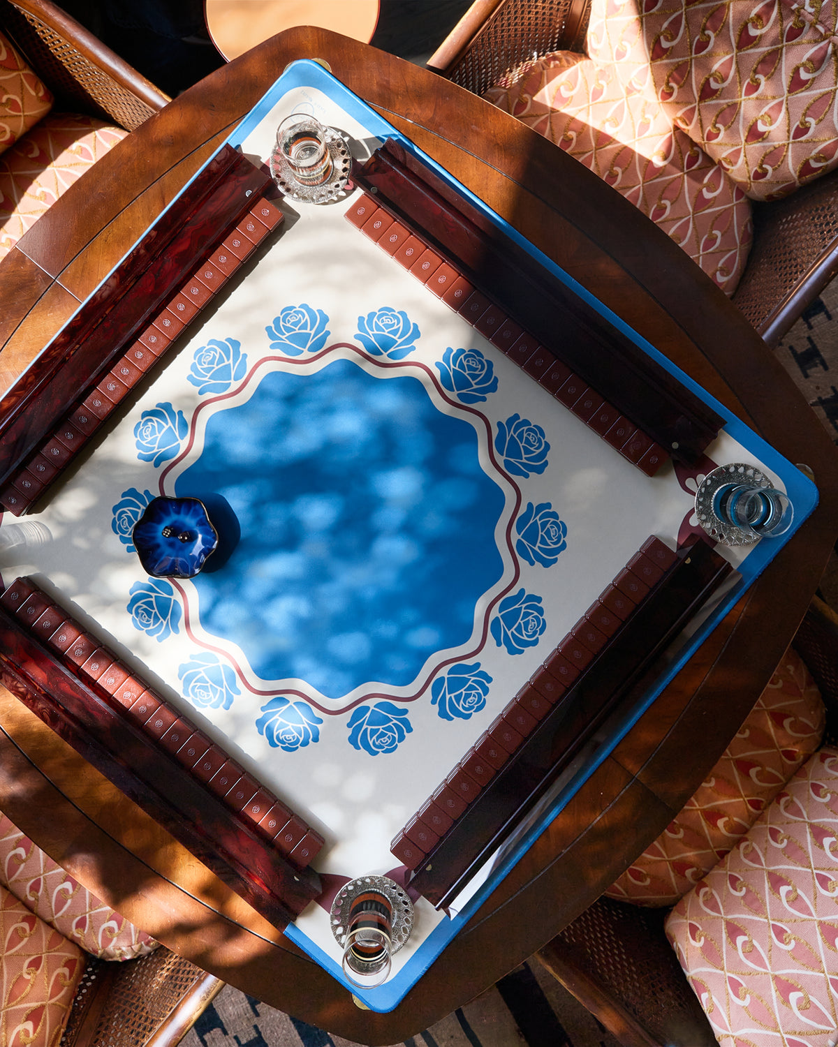 Briar mahjong mat on a mahjong table with acrylic racks, seen from above